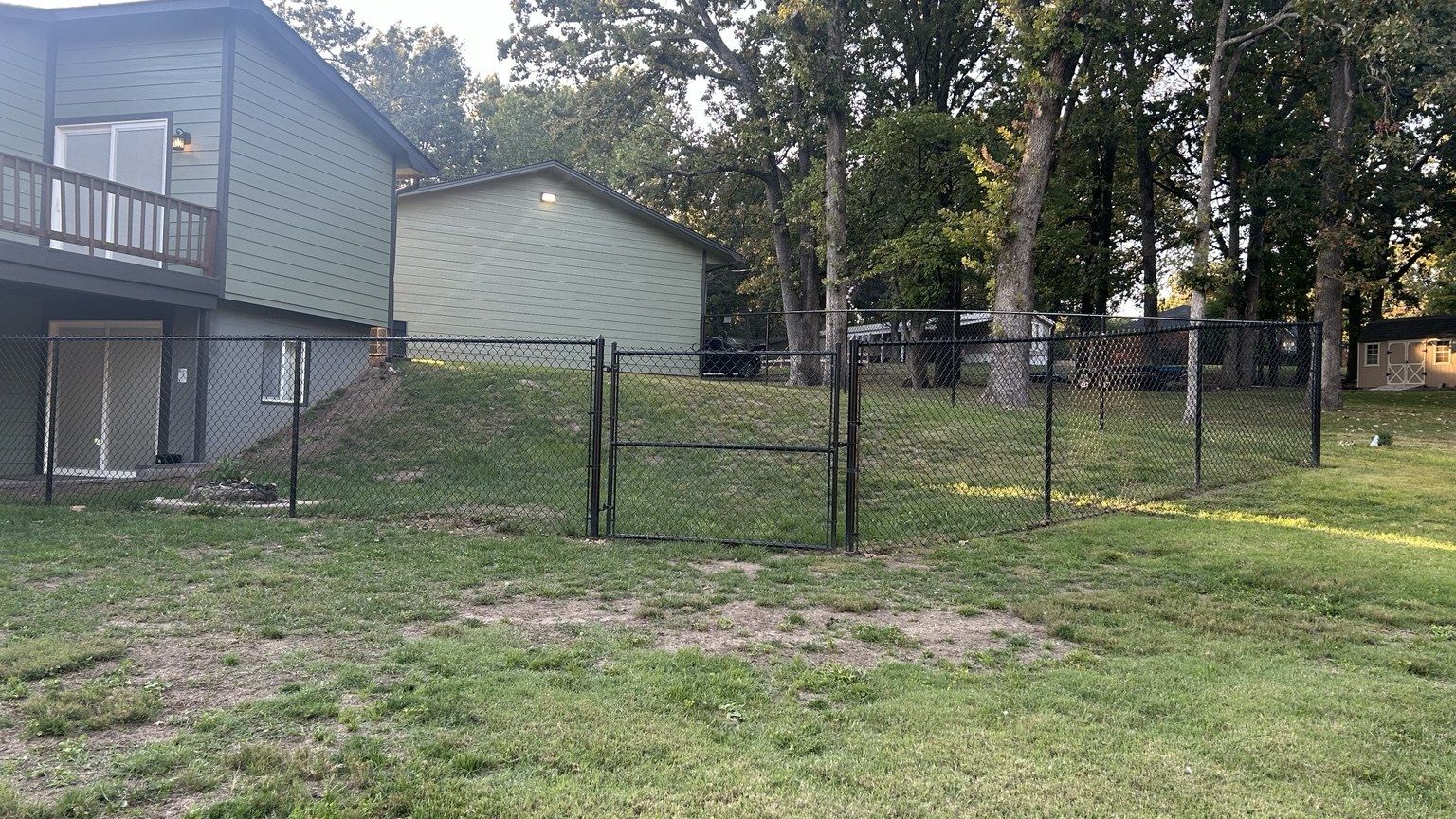 Fenced dog run beside Leisure Landing